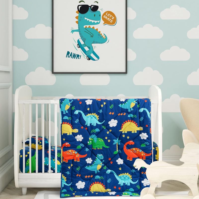 Photo 1 of Cloele Dinosaur Nursery Mini Crib Bedding Set for Boys - Microfiber 3 Piece Mini/Portable Crib Bedding Set for Mini Crib Comforter Fitted Mini Crib Sheets Pillowcase - Nursery Bedding Set for Baby