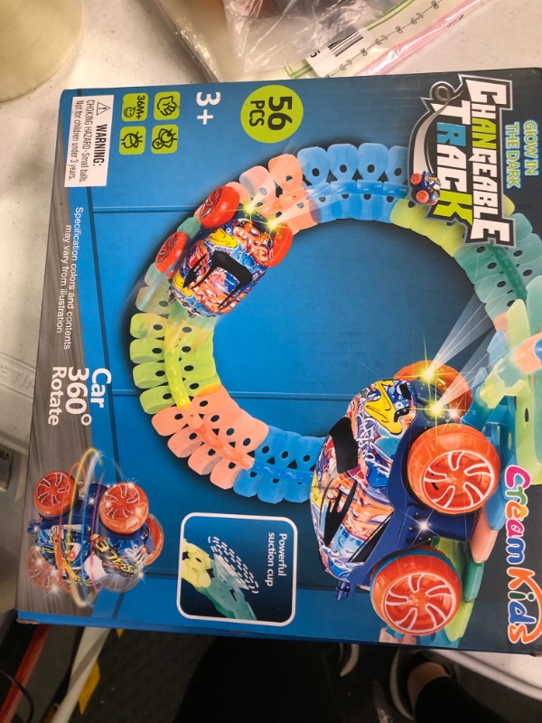 Photo 1 of CREAMKIDS Children's Race Track Car Sets, Luminous Suction Cup Track, Slot Race Car with LED Lights and Flexible Race Car's Changeable Track Set, for Children Over 3 Years Old(60pcs)