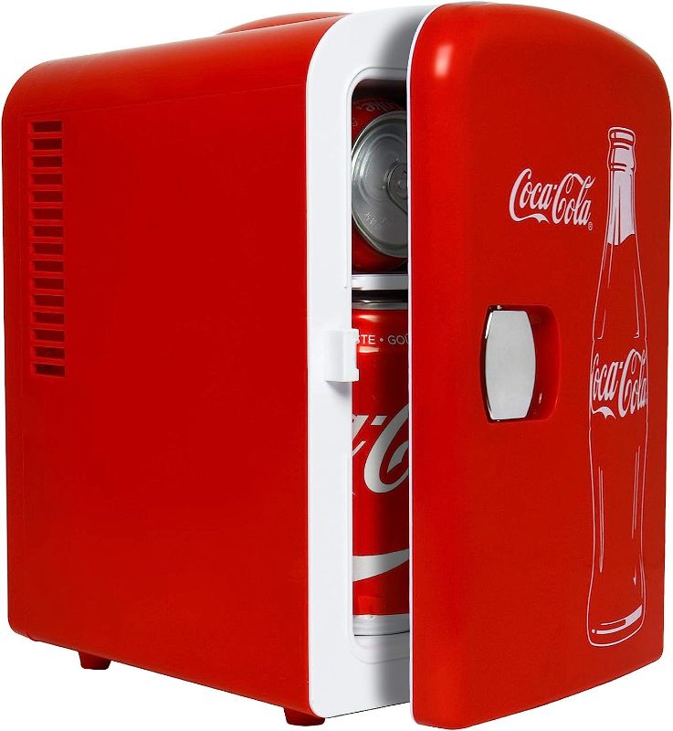 Photo 1 of ***FOR PARTS*** 

Coca-Cola Classic Coke Bottle 4L Mini Fridge w/ 12V DC and 110V AC Cords, 6 Can Portable Cooler, Personal Travel Refrigerator for Snacks Lunch Drinks Cosmetics, Desk Home Office Dorm, Red
