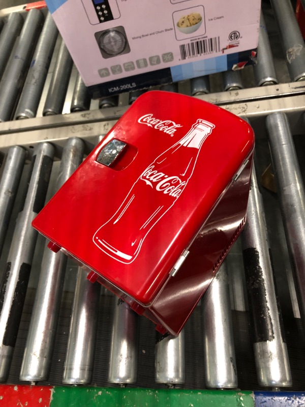 Photo 3 of ***FOR PARTS*** 

Coca-Cola Classic Coke Bottle 4L Mini Fridge w/ 12V DC and 110V AC Cords, 6 Can Portable Cooler, Personal Travel Refrigerator for Snacks Lunch Drinks Cosmetics, Desk Home Office Dorm, Red
