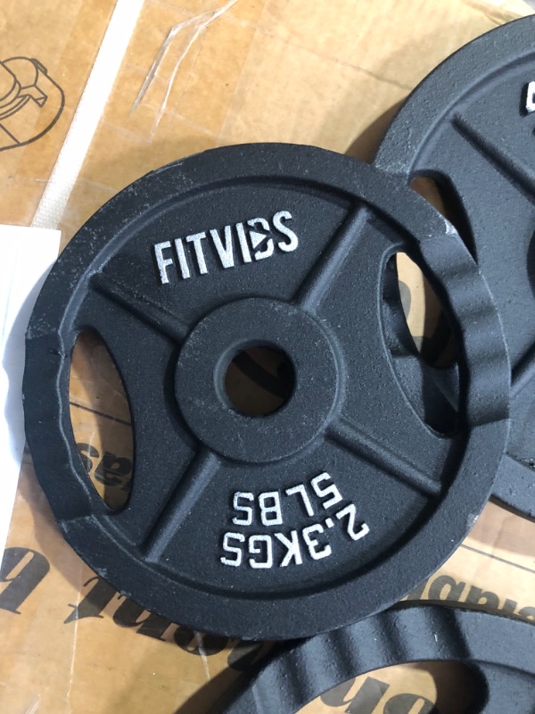 Photo 5 of ***USED - SCRATCHED AND CHIPPED - NO PACKAGING - SEE PICTURES***
Signature Fitness Cast Iron Standard Weight Plates Including 5FT Standard Barbell 