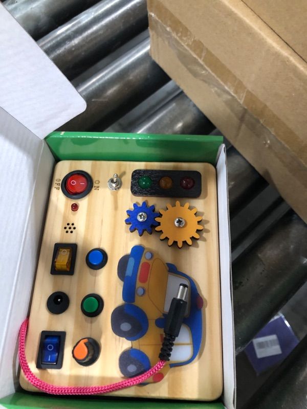 Photo 1 of Auney Montessori Busy Board with Traffic Led Lights,Wooden Sensory Toys for Toddlers 1,Baby Travel Toys with 7 Different Led Lights Sound Button,Educational Toys for 1+ Year Old Boy Car Style Gift