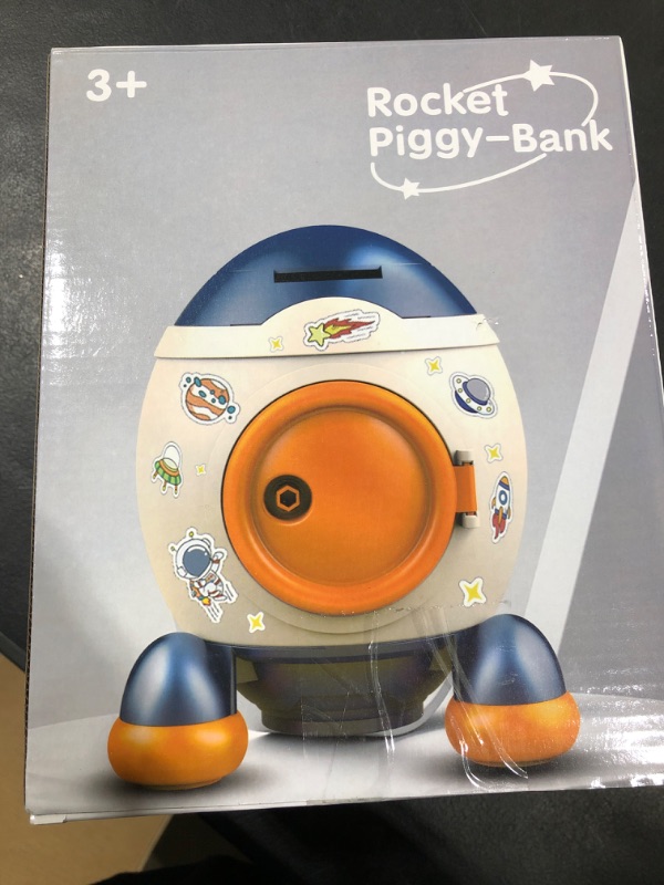 Photo 1 of BLUE ROCKET PIGGY BANK AGES 3+