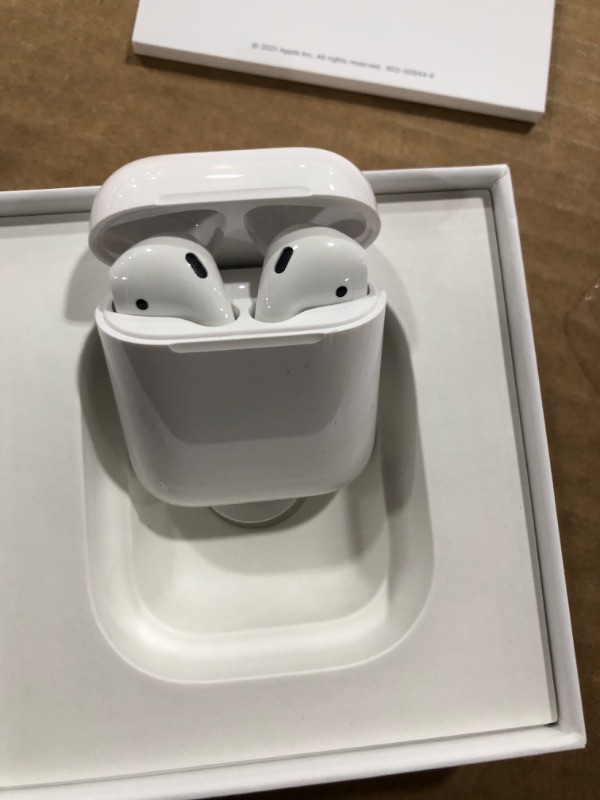 Photo 2 of Apple AirPods with Charging Case (Latest Model)