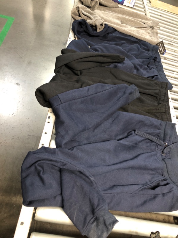 Photo 1 of **BUNDLE OF 4 **NONREFUNDABLE
SWEAT PANTS ONE XXL, LARGE, AND 2 MEDIUMS 