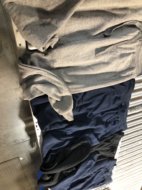 Photo 2 of **BUNDLE OF 4 **NONREFUNDABLE
SWEAT PANTS ONE XXL, LARGE, AND 2 MEDIUMS 