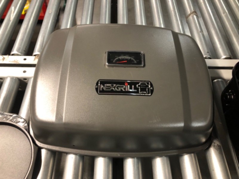 Photo 1 of ***ITEM APPEARS TO BE MISSING PROPANE HOSE ONLY***
Nexgrill 1-Burner Portable Propane GAS Table Top Grill in Black
