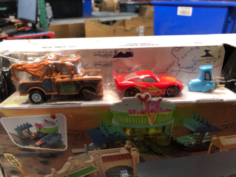 Photo 2 of Disney And Pixar Cars On The Road Radiator Springs Tour Playset With 2 Vehicles And Light-Up Countdown, Features Lightning McQueen Racer, Mater Truck And Guido Vehicles, Toy Gift For Kids