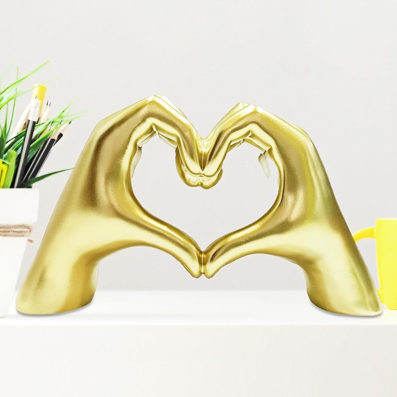 Photo 1 of FZWHC Gold Love Hands Statue for Living Room Decor,Heart Shape Hands Sculpture for Home Desk Decor Wedding Aesthetic Decoration Valinetine's Day Wedding Gifts