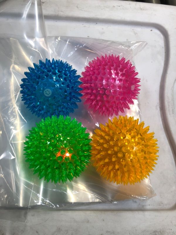 Photo 1 of 4 PCS LIGHT UP SQUEEK BALLS --COLORS VARY 