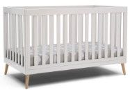 Photo 1 of Delta Children Essex 4-in-1 Convertible Baby Crib, Bianca White with Natural Legs + Simmons Kids Quiet Nights Dual Sided Crib and Toddler Mattress (Bundle)