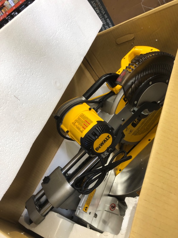 Photo 2 of DEWALT Miter Saw, 12 Inch Double Bevel Sliding Compound, Stainless Steel Detent Plate with 10 Stops, Cam-Lock Handle, For Quick & Accurate Miter Angles, Corded (DWS779)