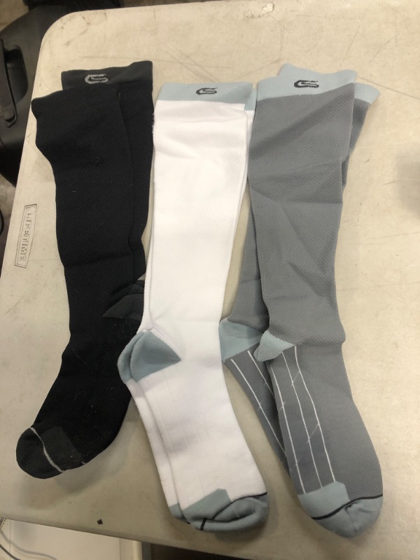 Photo 1 of 3 pairs of compression socks - 