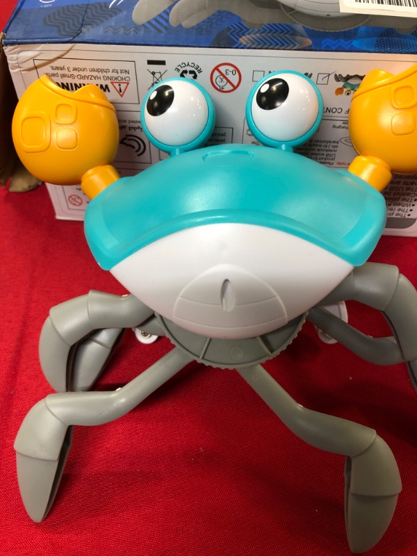 Photo 1 of Baby Crawling Crab Toy Baby Sensory Toys Tummy Time Toy Gifts for Boy Girl with Auto Crawl System Music for Walking Toddler Birthday Gift