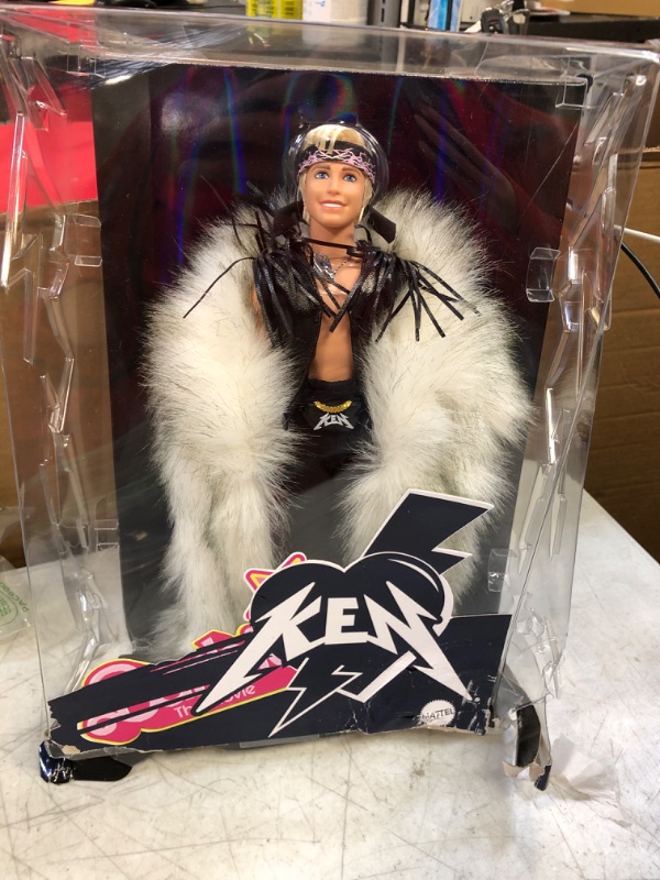 Photo 2 of Barbie The Movie Collectible Ken Doll Wearing Big Faux Fur Coat and Black Fringe Vest with Bandana