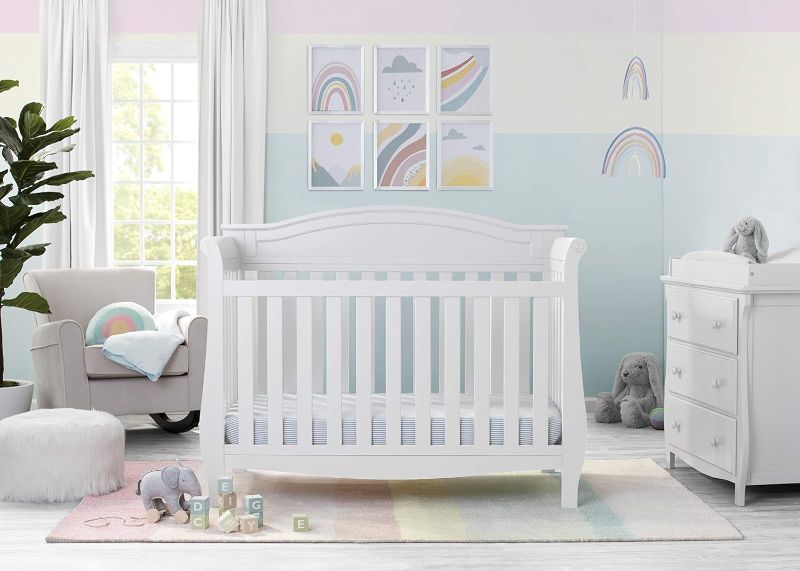 Photo 1 of Delta Children Lancaster 4-in-1 Convertible Baby Crib, Bianca White + Serta Perfect Slumber Dual Sided Recycled Fiber Core Crib and Toddler Mattress 4-in-1 Crib