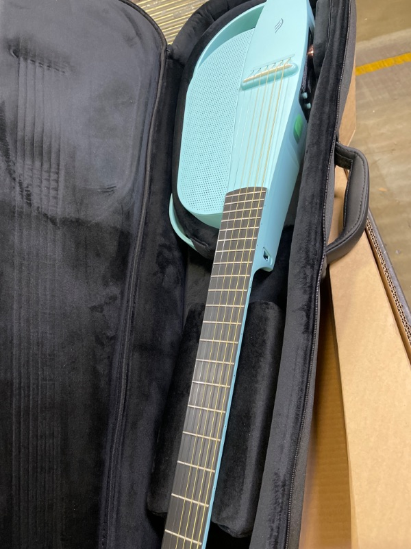 Photo 2 of Enya NEXG 2 Acoustic-Electric Guitar Carbon Fiber Travel Smart Audio Guitar with 50W Wireless Speaker, Wireless Microphone, Hi-Fi Monitor Earphones, Footswitch, Charging Stand, and Gigbag(Blue) Deluxe Blue