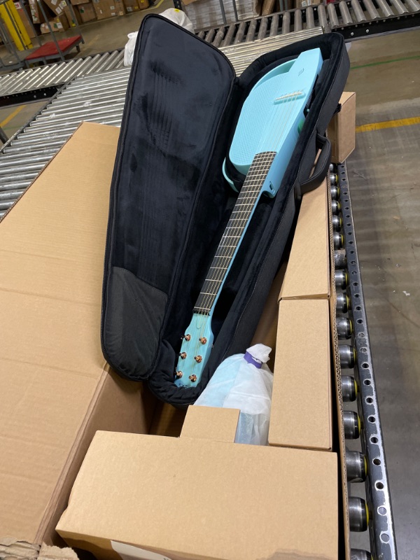 Photo 6 of Enya NEXG 2 Acoustic-Electric Guitar Carbon Fiber Travel Smart Audio Guitar with 50W Wireless Speaker, Wireless Microphone, Hi-Fi Monitor Earphones, Footswitch, Charging Stand, and Gigbag(Blue) Deluxe Blue