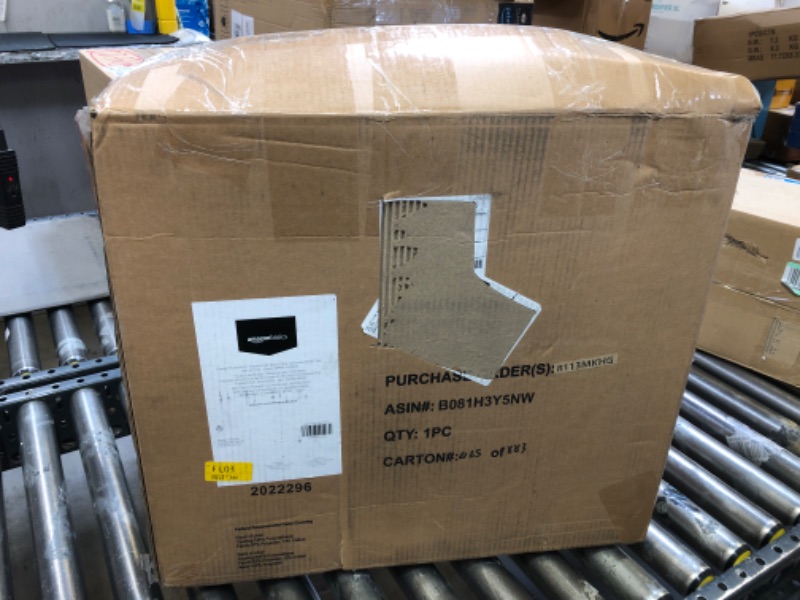 Photo 1 of Amazon Basics Classic Puresoft PU Padded Mid-Back Office Computer Desk Chair with Armrest, 25.75"D x 24.25"W x 42.25"H, Black