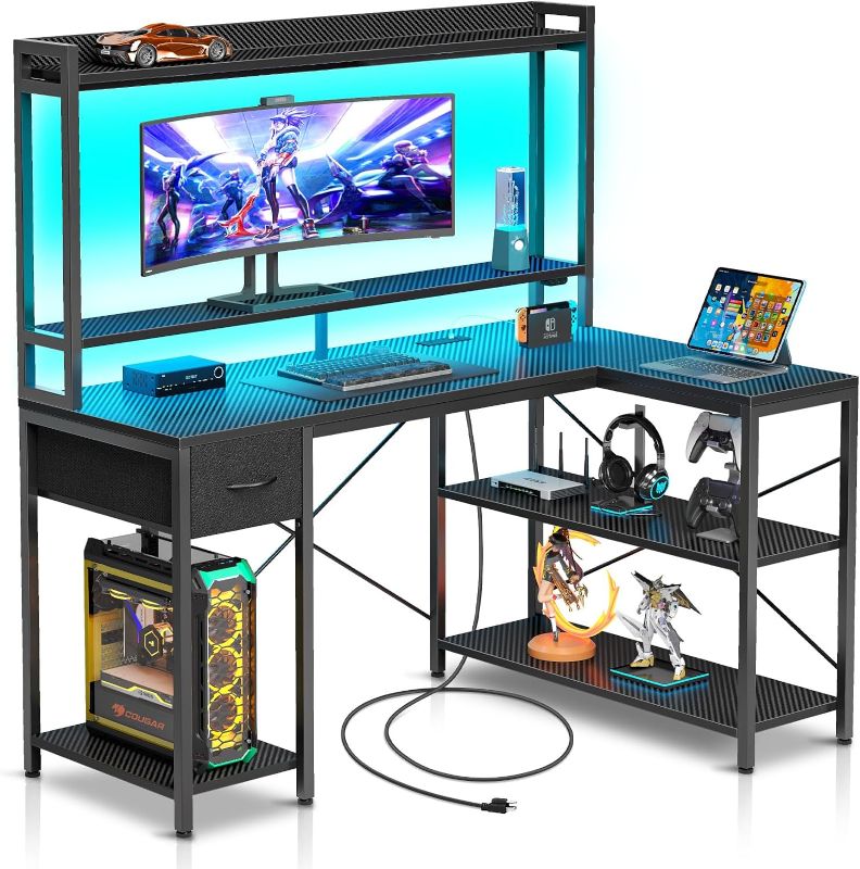 Photo 1 of Seventable Gaming Desk L Shaped with LED Lights & Power Outlets, Reversible Computer Desk with Shelves & Drawer, Corner Desk with Hutch Home Office Desk, Carbon Fiber Black
