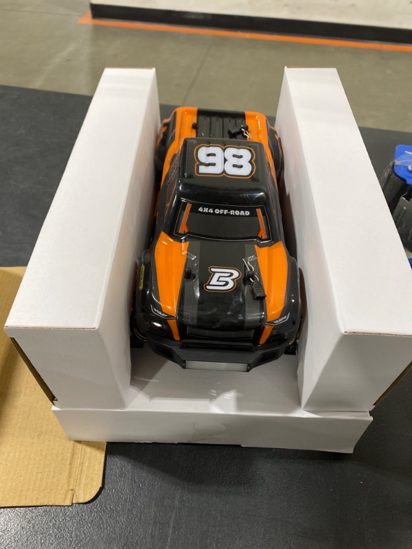 Photo 3 of BEZGAR 1:16 Scale High Speed RC Cars | HP161 4X4 Off-Road Electric RC Trucks, Waterproof Hobby Grade Remote Control Cars - All Terrain Toy Truck with Upgrade Chassis Two Batteries for Kid Adults Orange