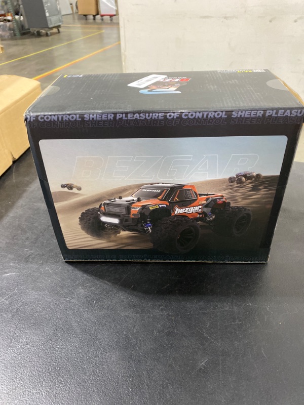 Photo 2 of BEZGAR 1:16 Scale High Speed RC Cars | HP161 4X4 Off-Road Electric RC Trucks, Waterproof Hobby Grade Remote Control Cars - All Terrain Toy Truck with Upgrade Chassis Two Batteries for Kid Adults Orange