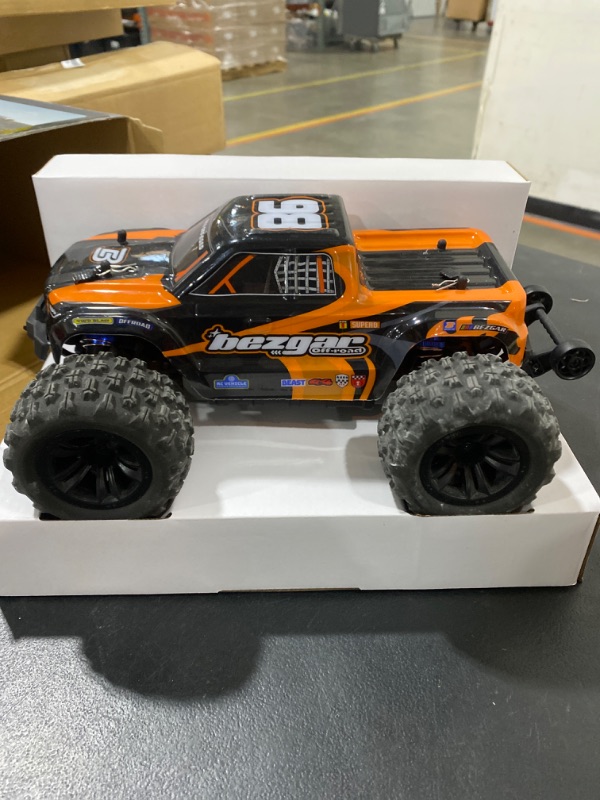 Photo 4 of BEZGAR 1:16 Scale High Speed RC Cars | HP161 4X4 Off-Road Electric RC Trucks, Waterproof Hobby Grade Remote Control Cars - All Terrain Toy Truck with Upgrade Chassis Two Batteries for Kid Adults Orange