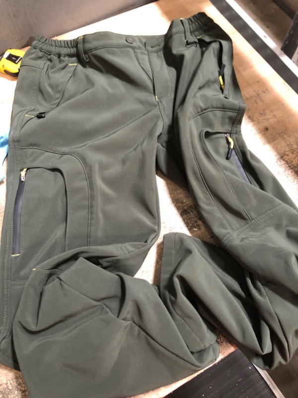 Photo 1 of green pants with multi pockets size 34