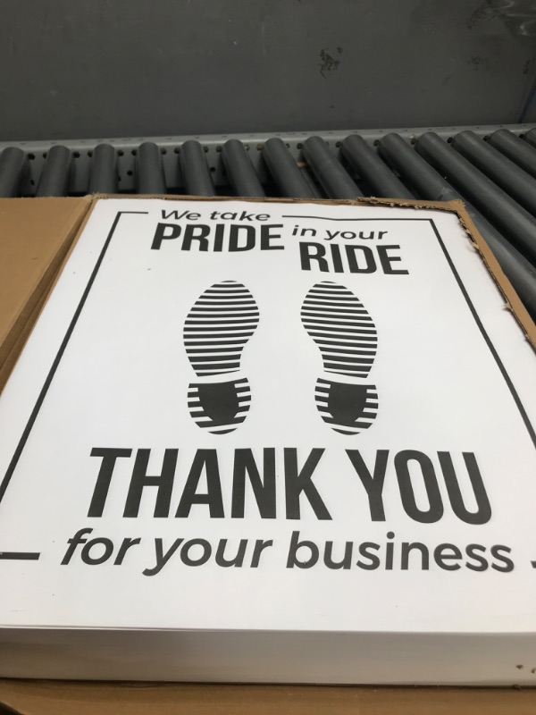 Photo 2 of CastleDoor Automotive Floor Mats Plastic Coated Disposable Heavy-Duty Paper “We Take Pride in Your Ride” Shoe Print Floor Mat (Case of 500)