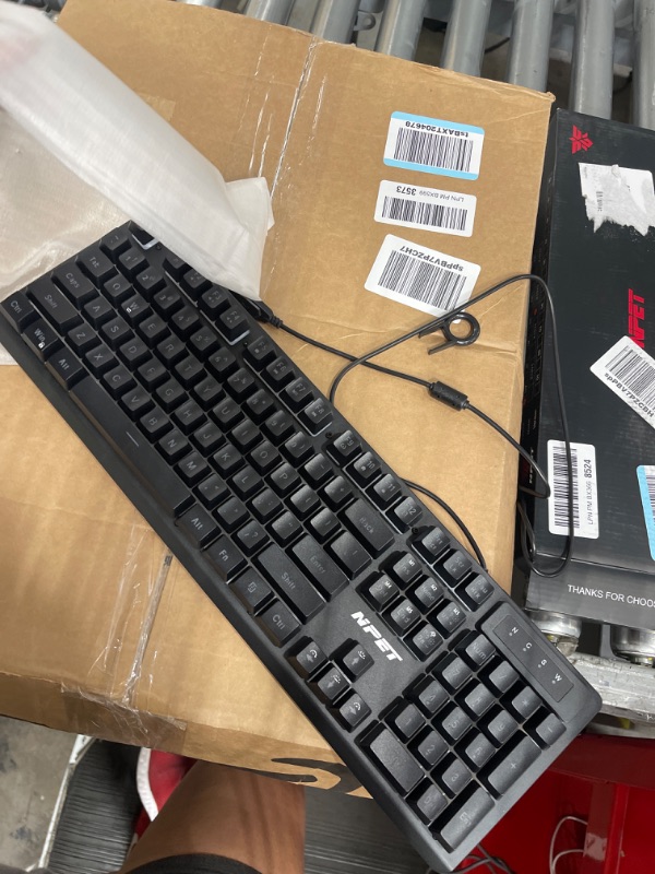 Photo 1 of NPET K10 Gaming Keyboard USB Wired Floating Keyboard, Quiet Ergonomic Water-Resistant Mechanical Feeling Keyboard, Ultra-Slim Rainbow LED Backlit Keyboard for Desktop, Computer, PC