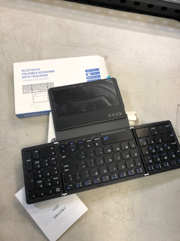 Photo 1 of Mini Bluetooth Foldable Keyboard with Touchpad