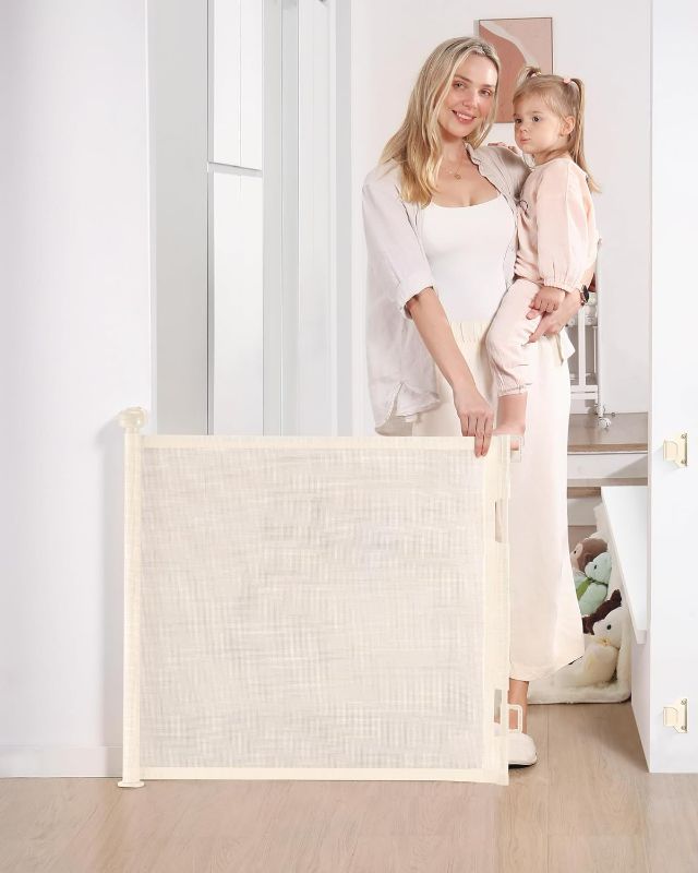 Photo 1 of Retractable Baby Gate, Mesh Baby and Pet Gate 33" Tall, Extends up to 55" Wide, Child Safety Baby Gates for Stairs Doorways Hallways, Dog Gate Cat Gate for Indoor and Outdoor (Beige)