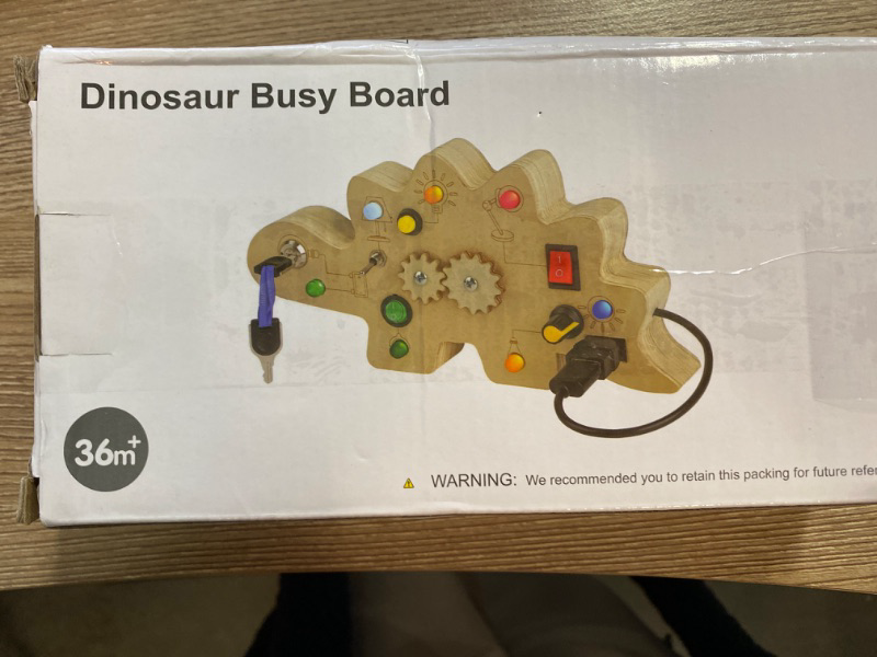 Photo 2 of SUPKIZ Toddler Busy Board, Montessori Toys for 1-3 + Year Old Baby, Wooden Busy Board with Led Light, Dinosaur Toddler Toys Sensory Toys Travel Toys for Age 1 2 3 + Boy Girl Birthday Gift
