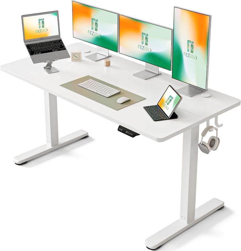 Photo 1 of FEZIBO Electric Standing Desk, 63 x 24 Inches Height Adjustable Stand up Desk, Sit Stand Home Office Desk, Computer Desk, White
