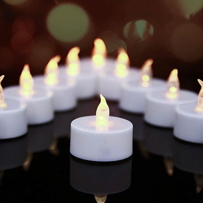 Photo 1 of 24 Pack Battery Operated Tea Lights - Flameless Votive Candles Realistic and Bright Flickering LED Ted Lights Candles Lamp Lasting 200 Hours for Home Decoration Holiday Wedding Party(White)