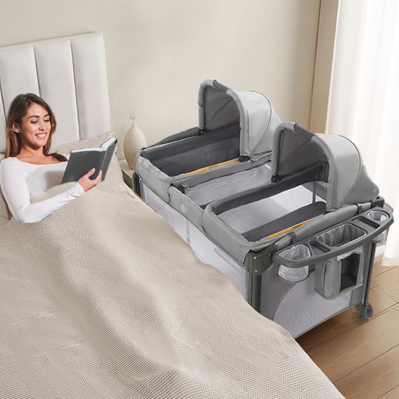 Photo 1 of JOYMOR Twin Bassinet for Baby with Storage, Convertible to Crib Playpen, Unisex Infant Side Sleeper
