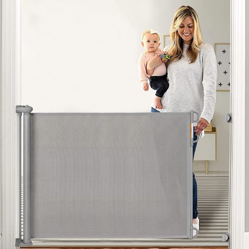 Photo 1 of Retractable Baby Gate, Momcozy Extra Wide Mesh Baby Gates for Stairs, 33" Tall, Extends to 71" Wide, Pet Dog Gate for Doorways, Stairs, Hallways, Indoor/Outdoor https://a.co/d/3qb8Z2I