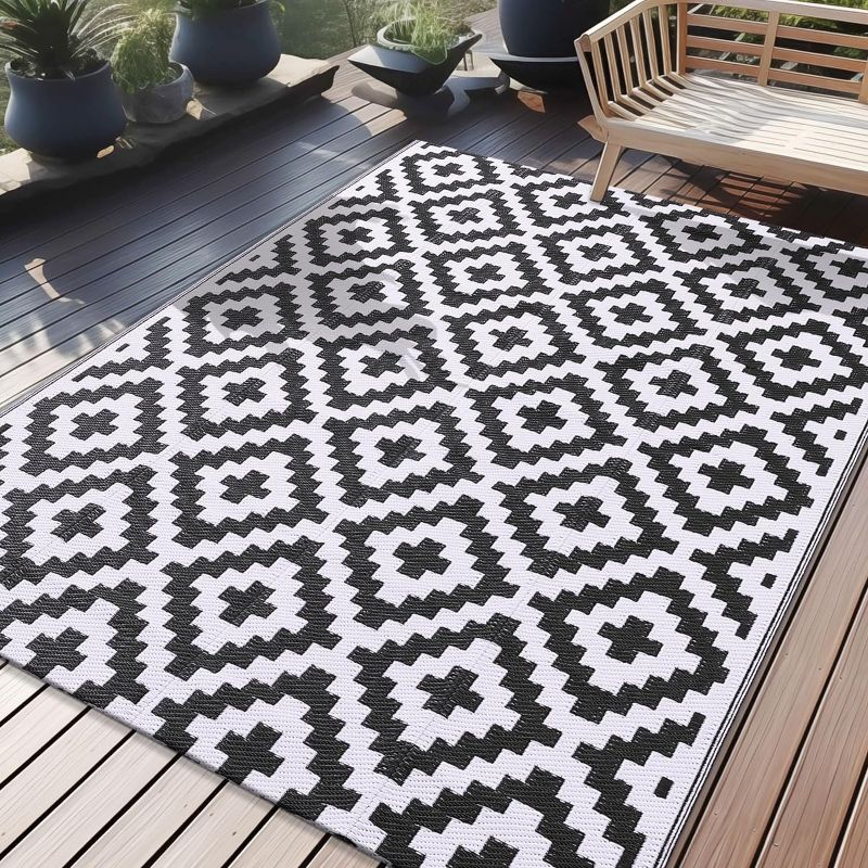 Photo 1 of  Waterproof Outdoor Rug Reversible Plastic Straw Patio Rug for Camping, RV Mat Outside, Indoor Outdoor Carpet for Porch, Deck, Backyard, Camper, Balcony- Unknown