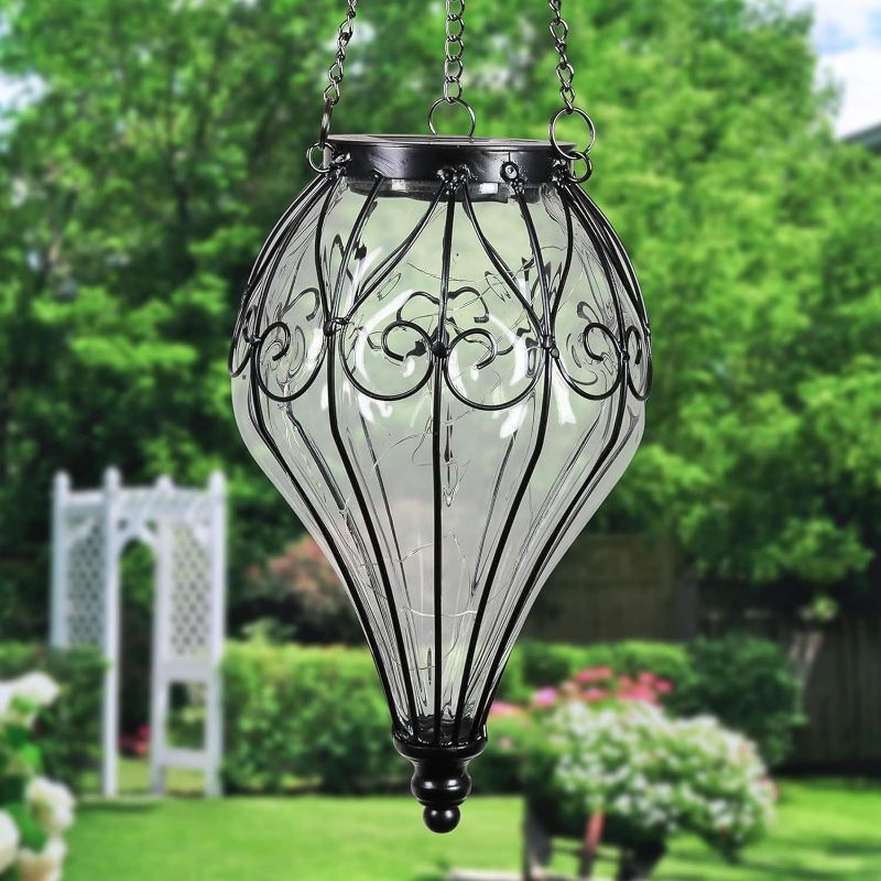 Photo 1 of 
Exhart Garden Solar Lights, Tear Shaped Hanging Lantern, Outdoor Clear Glass and Metal Decoration, 15 LED Firefly Lights, 6.5 x 6.5 x 23.5 Inch