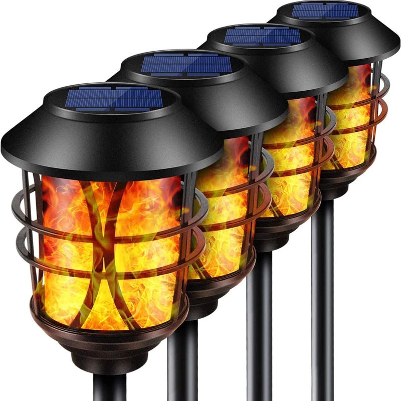 Photo 1 of TomCare Solar Lights Metal Flickering Flame Solar Torches Lights Waterproof Outdoor Heavy Duty Lighting Solar Pathway Lights Landscape Lighting Dusk to Dawn Auto On/Off for Garden Patio Yard, 4 Pack