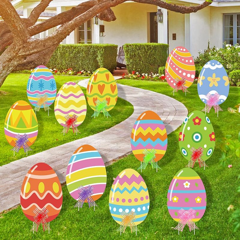 Photo 1 of  Easter Eggs Yard Signs Outdoor Decorations with Stakes and Bow, Colorful Cute Easy to Install Funny for Party Garden Yards Pathway Walkway (Cute Cartoon Pattern)