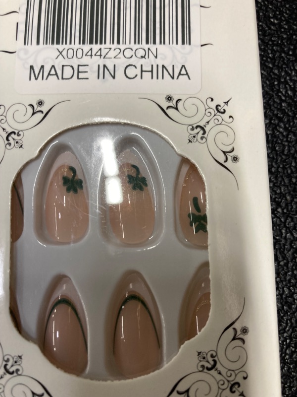 Photo 1 of 24 Pcs White French Press on Nails Short Almond Fake Nails Nude Pink False Nails with Clover Designs Glitter Full Cover Stick on Nails Artificial Nails for Women Girls St Patricks Day Nails https://a.co/d/cnlE1kQ