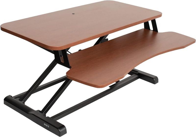 Photo 1 of VIVO 32 inch Desk Converter, K Series, Height Adjustable Sit to Stand Riser, Dual Monitor and Laptop Workstation with Wide Keyboard Tray, Dark Walnut Top, Black Frame, DESK-V000KA
