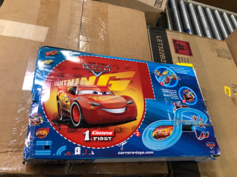 Photo 1 of Carrera First Disney/Pixar Cars - Slot Car Race Track - Includes 2 Cars: Lightning McQueen and Dinoco Cruz - Battery-Powered Beginner Racing Set for Kids Ages 3 Years and Up Disney Cars w/ Spinners