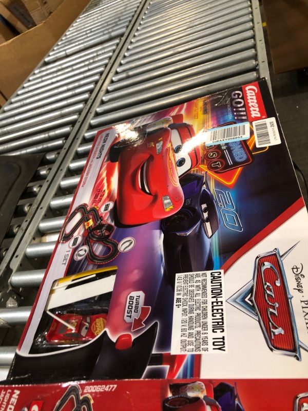 Photo 1 of Carrera GO!!! 62477 Disney Pixar Cars Neon Nights Electric Slot Car Racing Kids Toy Race Track Set Includes 2 Controllers and 2 Cars in 1:43 Scale Disney Cars Neon