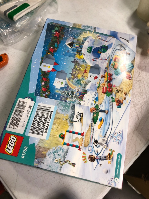 Photo 2 of LEGO Friends 2023 Advent Calendar 41758 Christmas Holiday Countdown Playset, 24 Collectible Daily Surprises Including 2 Mini-Dolls and 8 Pet Figures