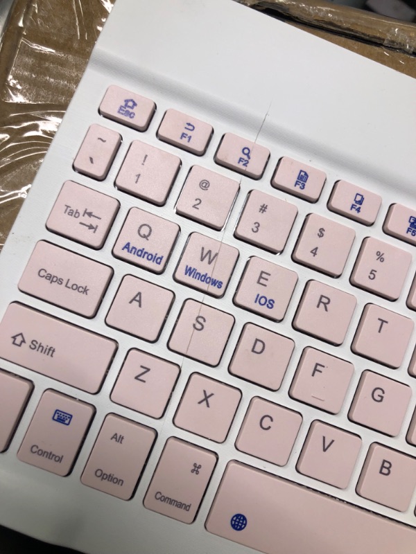 Photo 4 of **Has a cut on top of keyboard, left side**
Ultra-Slim Rechargeable Bluetooth Keyboard Portable Compact Wireless Keyboard for Android Windows Samsung Galaxy Tab Tablet Smartphone Cell Phone iOS iPhone iPad, iPad Pro, iPad Air, iPad Mini (Pink