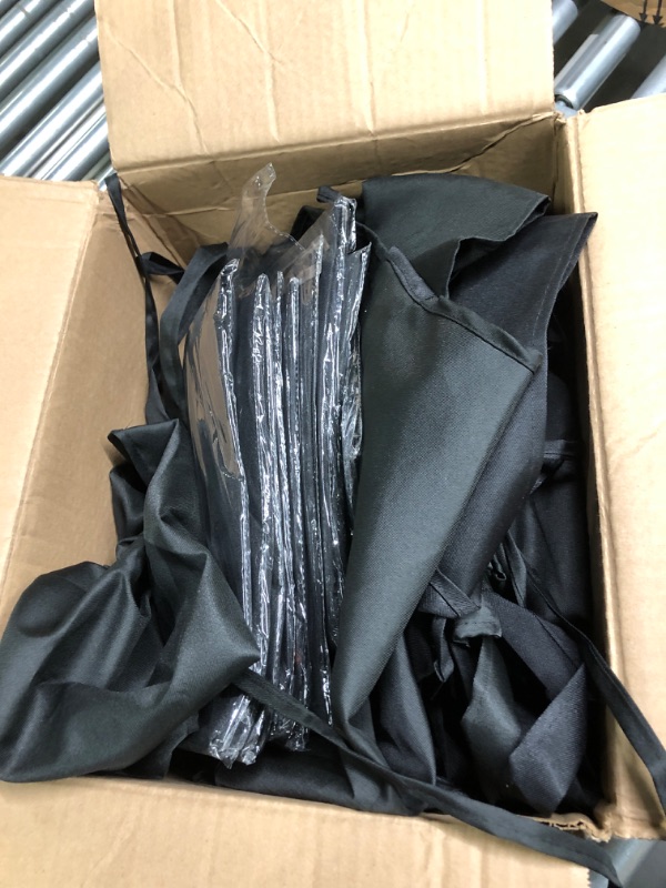 Photo 3 of Bulk pack of medium sized black aprons unknown quantity 