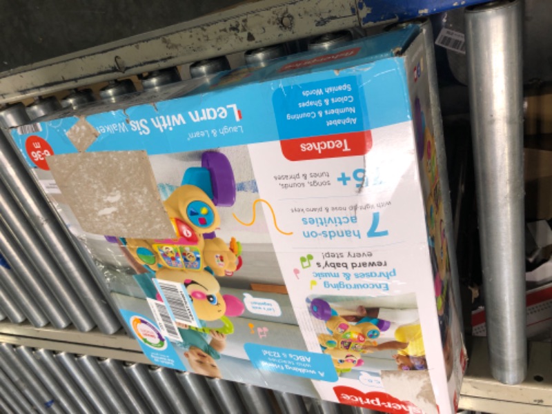 Photo 1 of Fisher-Price Laugh & Learn Baby Walker and Musical Learning Toy with Smart Stages Educational Content, Learn with Sis? Sis Walker