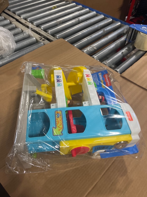 Photo 1 of Fisher-Price Little People Toddler Playset with Spiral Race Track, Elevator and 2 Wheelies Toy Cars, Helpful Neighbor’s Garage